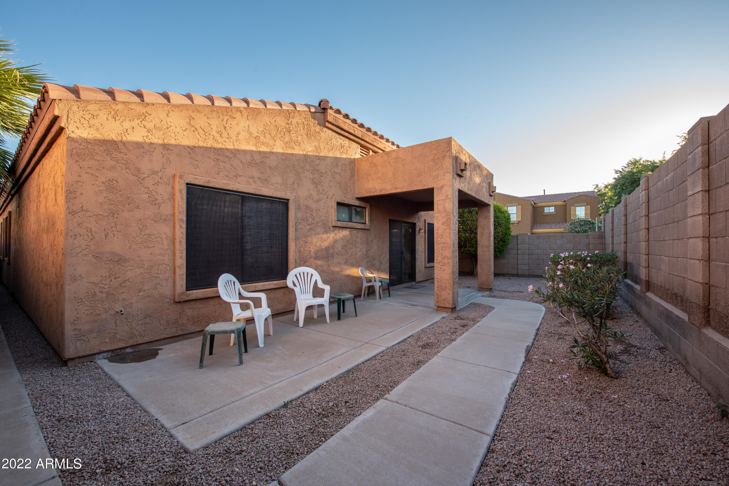 7030 South 30th Street Phoenix, AZ 85042 - Photo 14 of 18 a view of a dinning table and chairs in patio