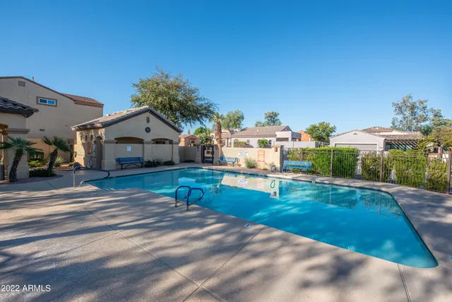 a view of house with garden space and car parked