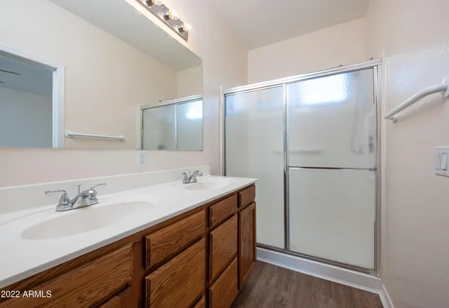 a bathroom with a sink and mirror