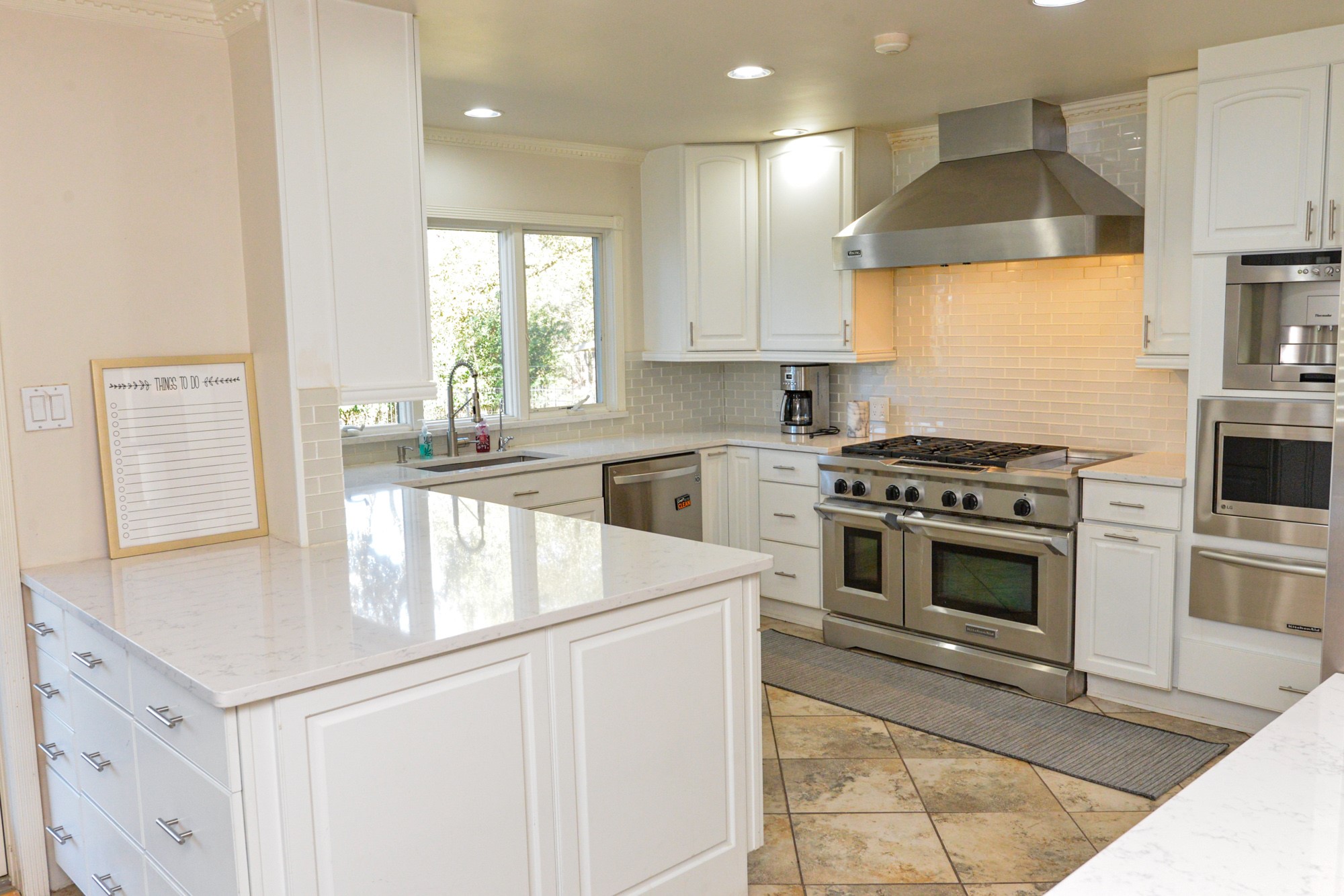 10710 D-K Ranch Road Austin, TX 78759 - Photo 7 of 34 Culinary delights await in this bright kitchen, complete with modern appliances and ample counter space.