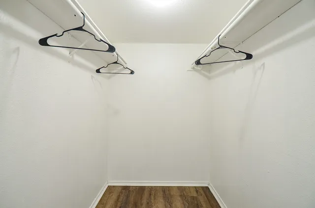 a view of a room with racks on the wall