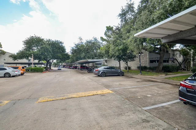 a view of street with parked cars