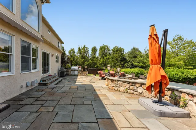 a view of a backyard with sitting area