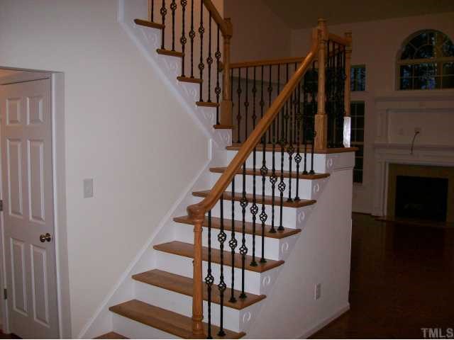 909 Lakeview Road Durham, NC 27712 - Photo 8 of 12 Beautiful wood staircase with iron railings