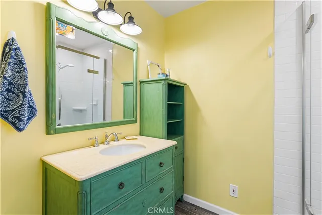 a bathroom with a sink and a mirror