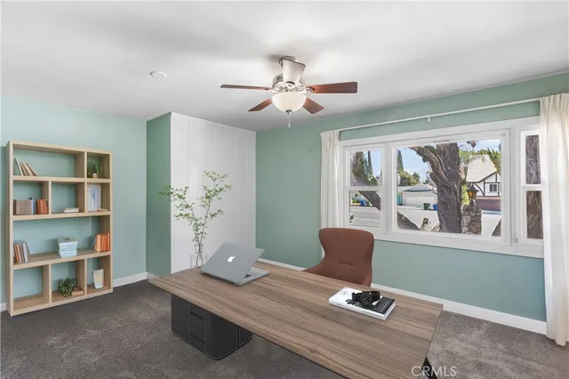 a living room with furniture and window