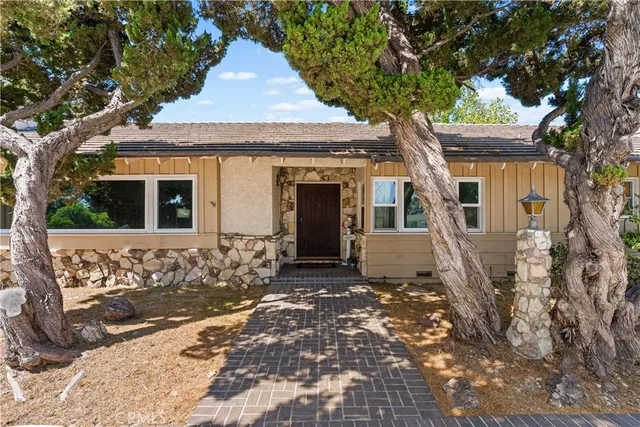 a front view of a house with yard