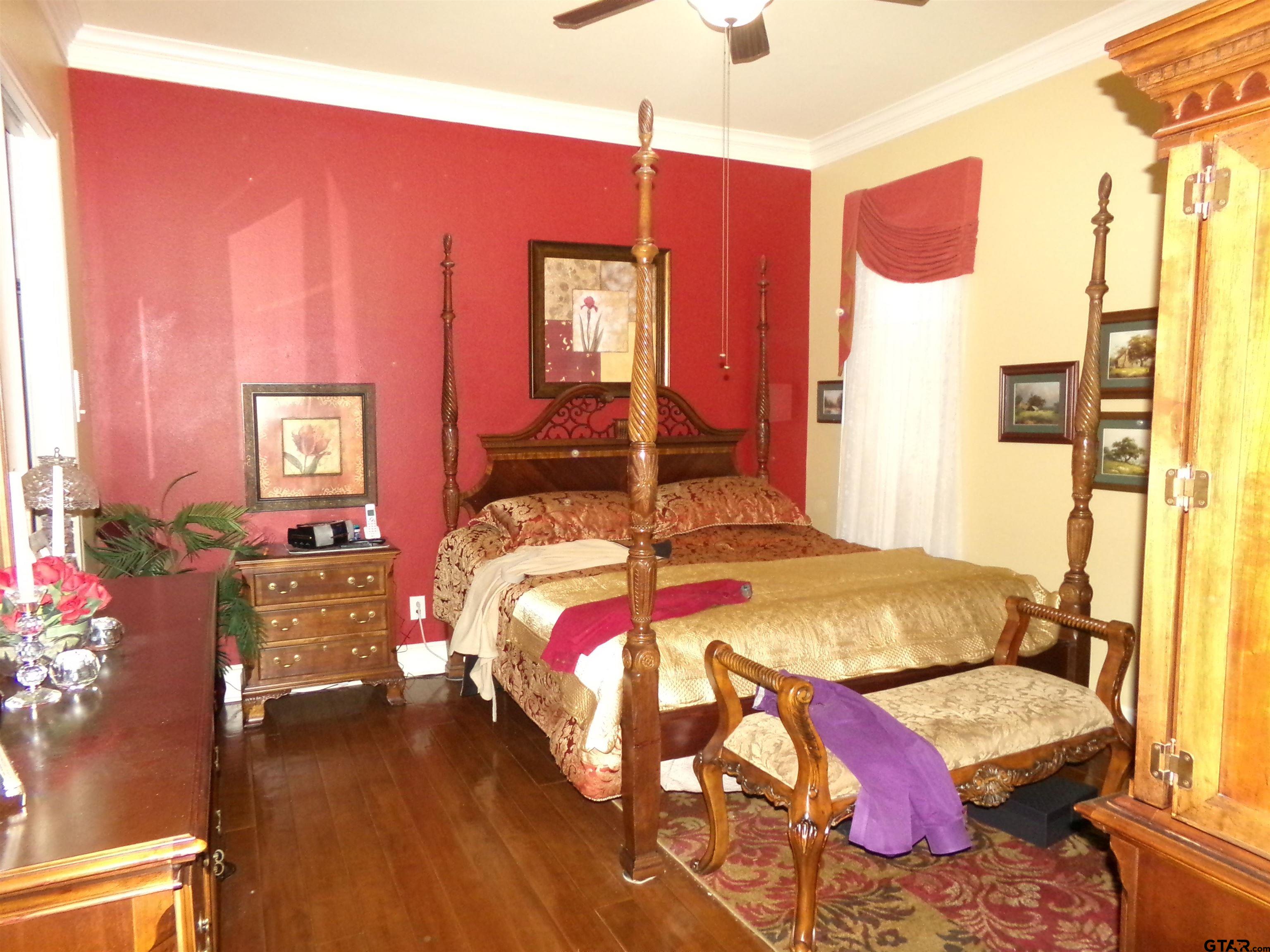 2425 Dietz Lane Tyler, TX 75701 - Photo 12 of 18 a bedroom with a bed and wooden floor