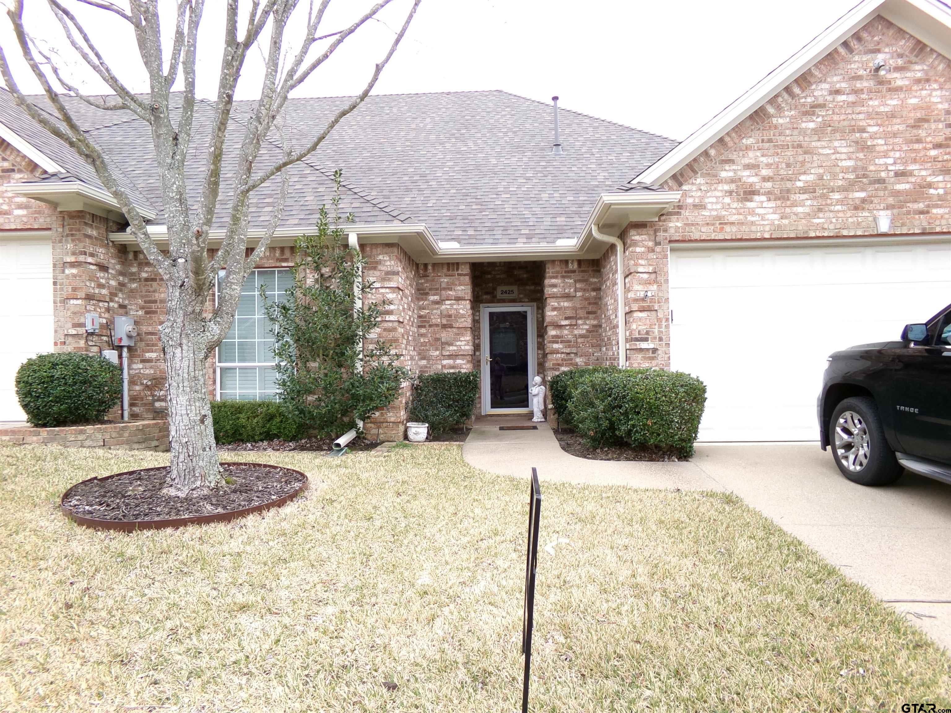 2425 Dietz Lane Tyler, TX 75701 - Photo 2 of 18 a view of a house with snow on the side of it