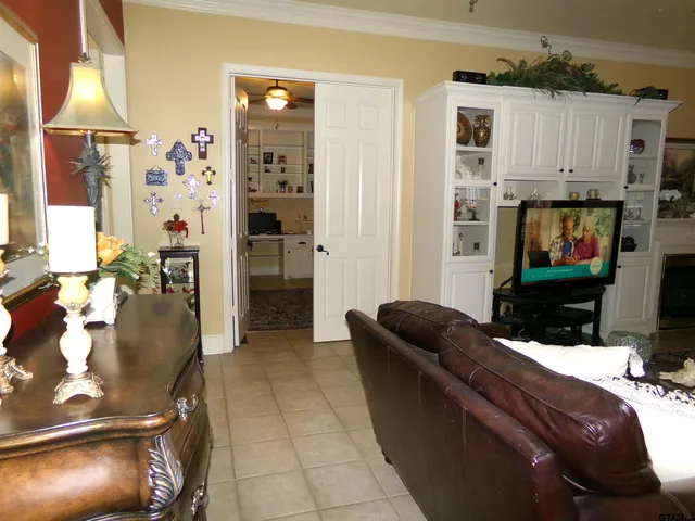 a living room with furniture and a flat screen tv