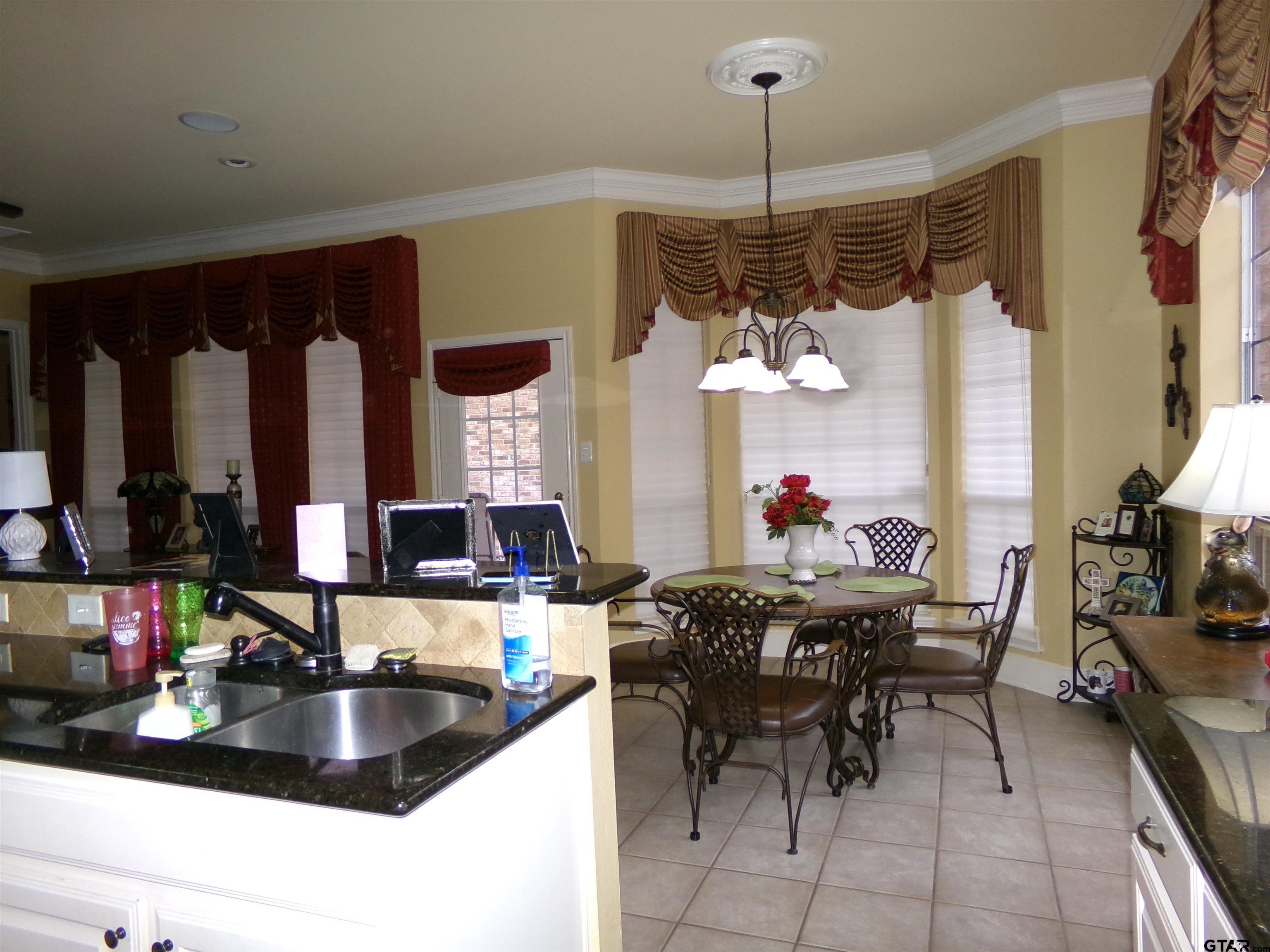 2425 Dietz Lane Tyler, TX 75701 - Photo 9 of 18 a kitchen with a table and chairs in it
