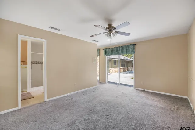 a bathroom with a granite countertop sink a mirror and a vanity