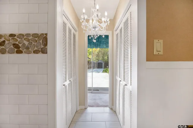 an empty room with a empty space and windows