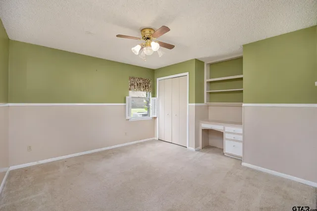 a bathroom with a sink double vanity granite tub and a mirror