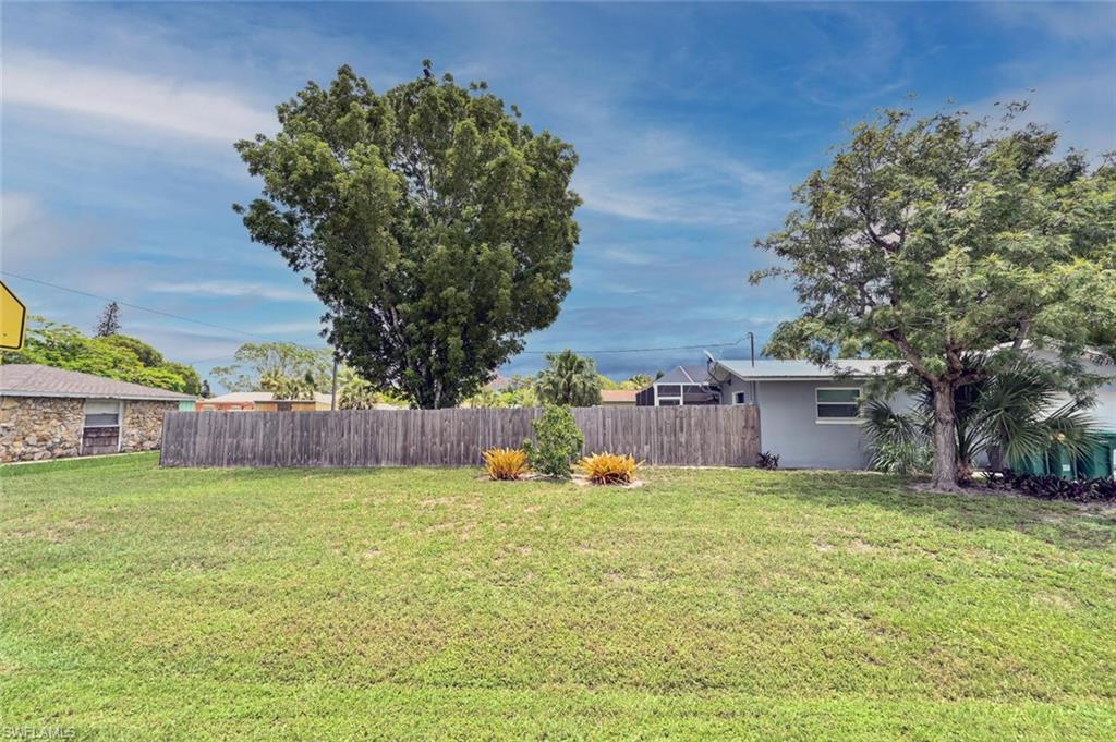 3131 Calusa Avenue Naples, FL 34112 - Photo 17 of 26 a view of a yard with a house
