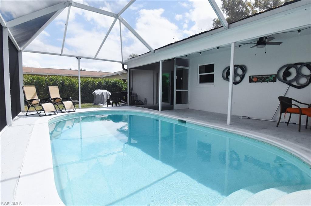 3131 Calusa Avenue Naples, FL 34112 - Photo 2 of 26 a view of a house with porch and furniture