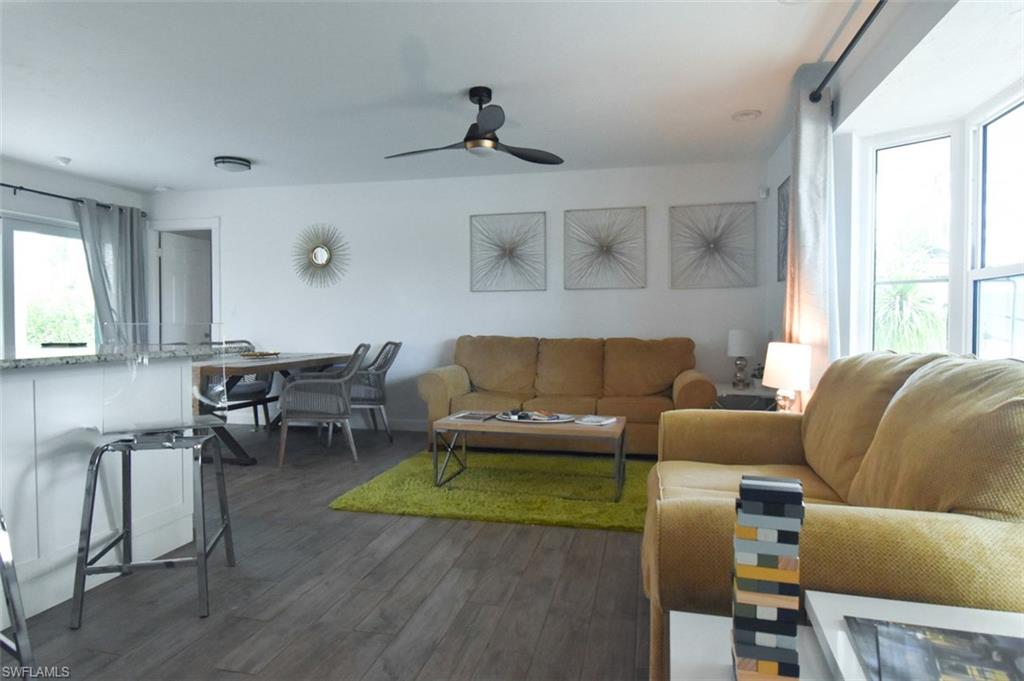 3131 Calusa Avenue Naples, FL 34112 - Photo 21 of 26 a living room with furniture and a window
