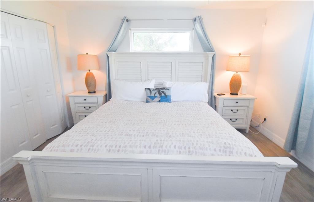 3131 Calusa Avenue Naples, FL 34112 - Photo 10 of 26 a bathroom with a sink mirror and vanity