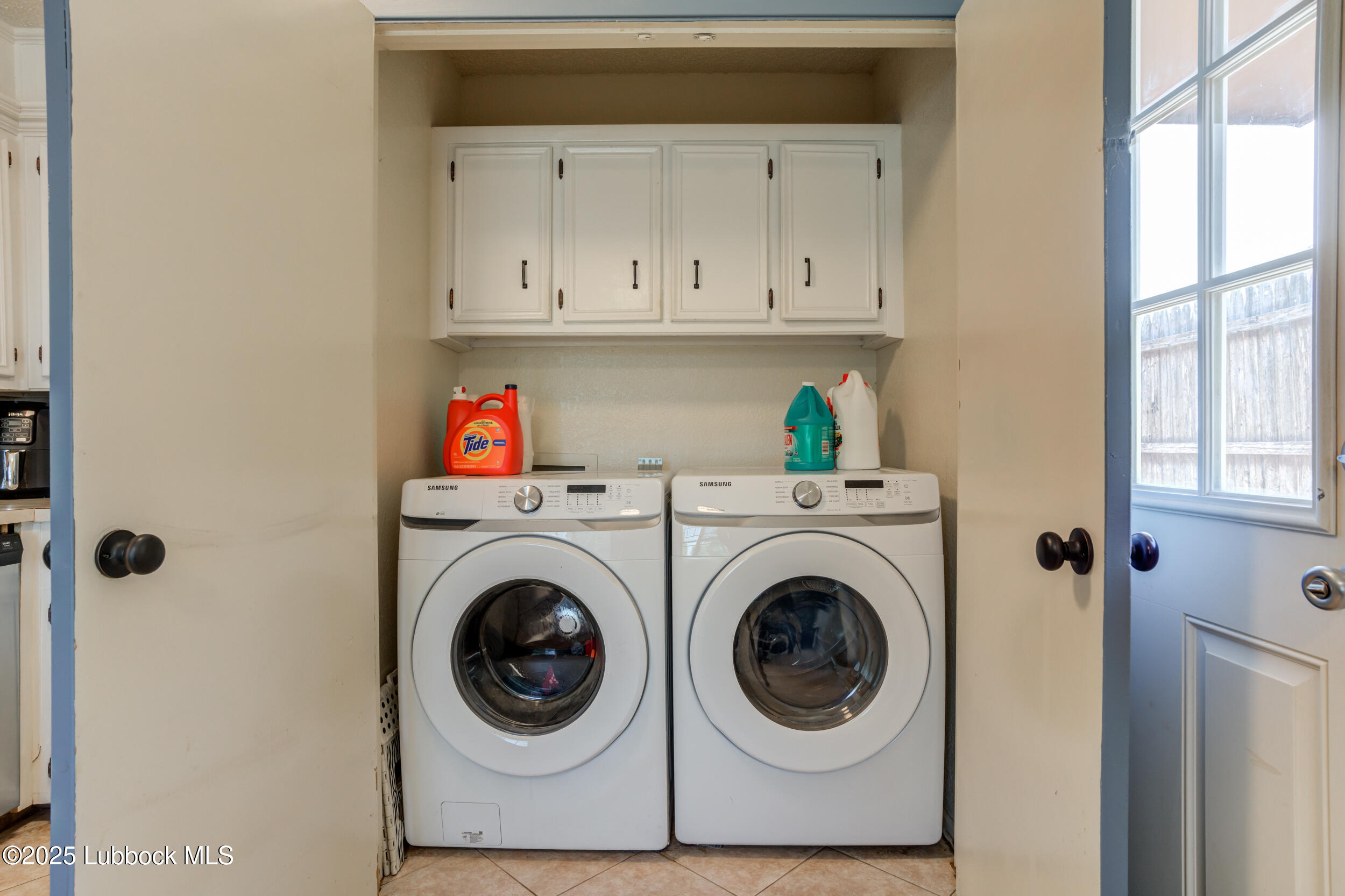 6403 28th Street Lubbock, TX 79407 - Photo 12 of 27 a utility room with dryer and washer