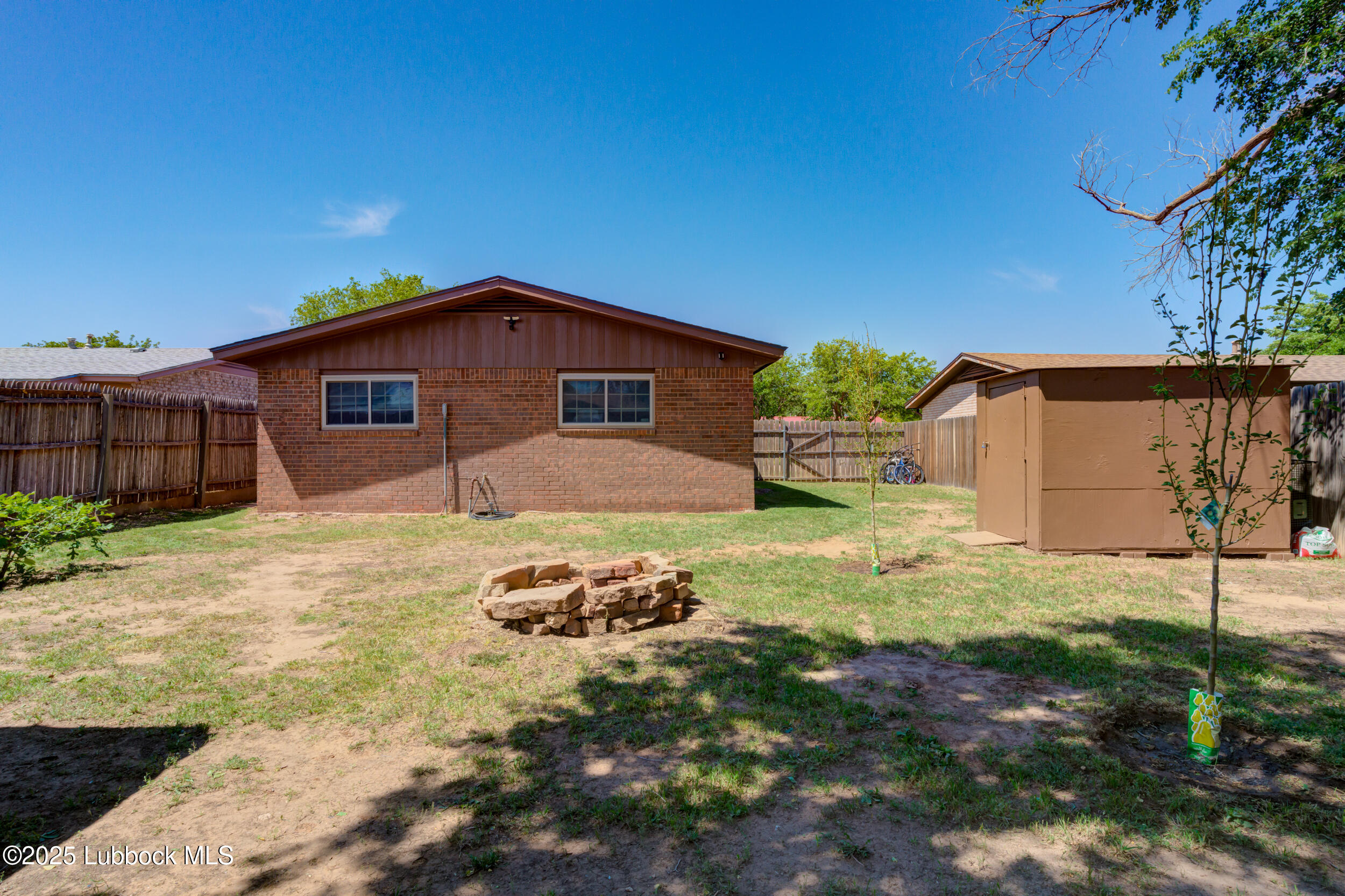 6403 28th Street Lubbock, TX 79407 - Photo 24 of 27 a front view of a house with a yard