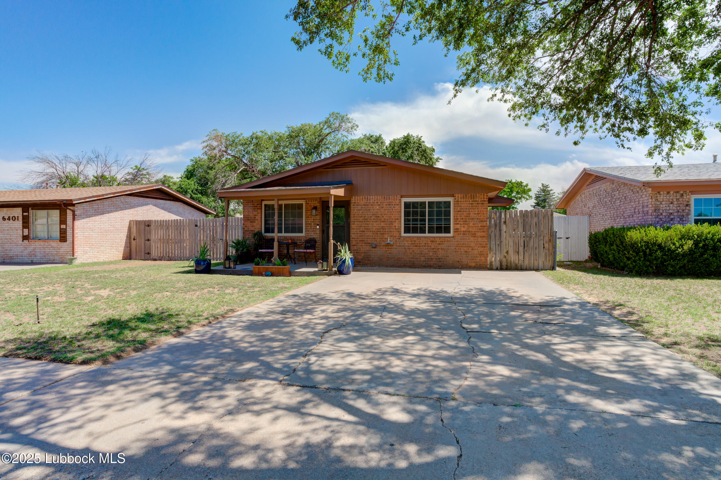 6403 28th Street Lubbock, TX 79407 - Photo 27 of 27 a front view of a house with a yard and garage
