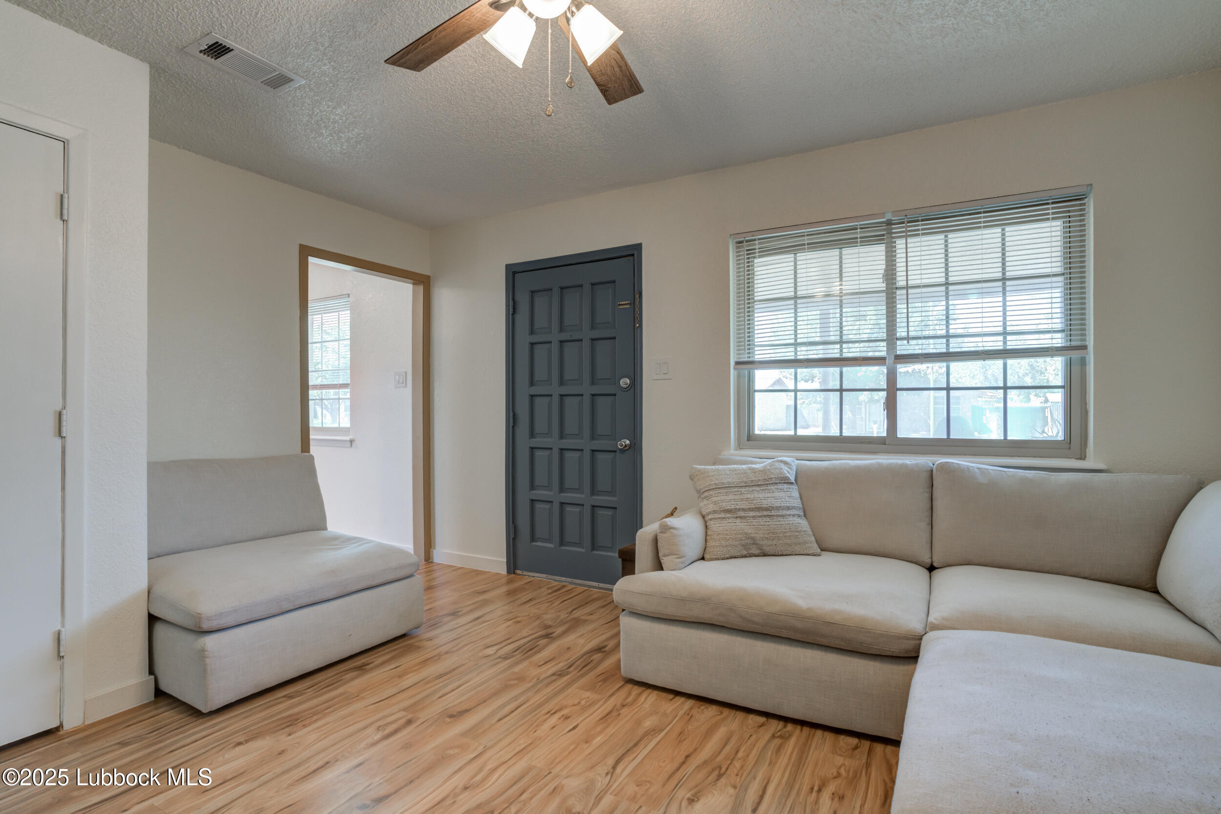6403 28th Street Lubbock, TX 79407 - Photo 3 of 27 a living room with furniture and a window
