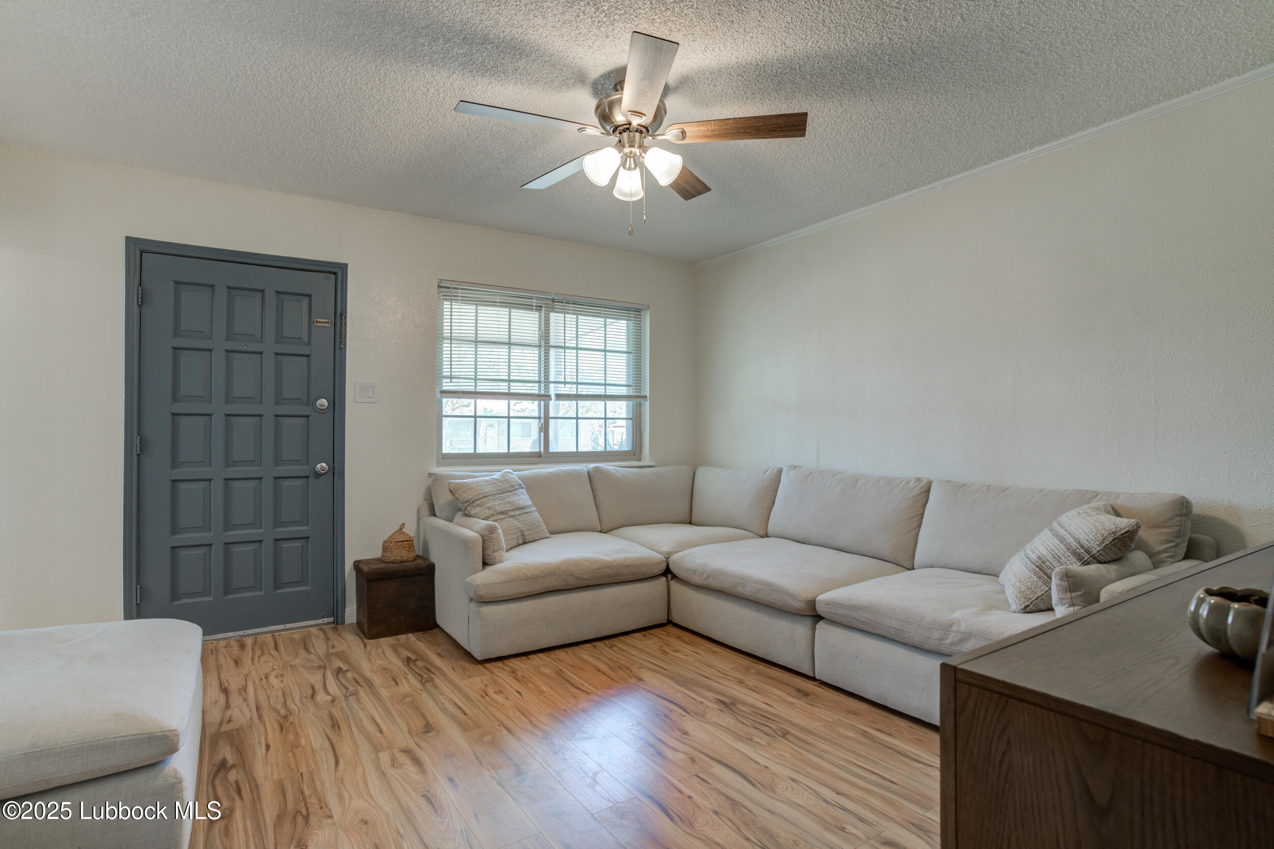 6403 28th Street Lubbock, TX 79407 - Photo 6 of 27 a living room with furniture and a window