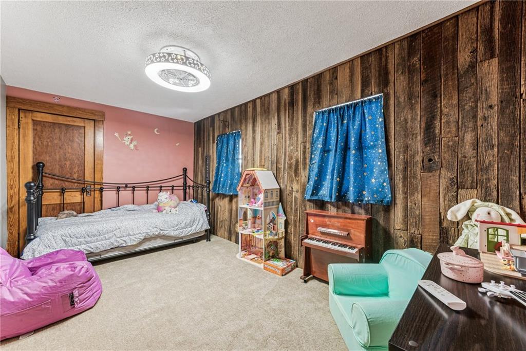 3150 Dutch Ridge Road Beaver, PA 15009 - Photo 20 of 41 a bedroom with furniture and a chair