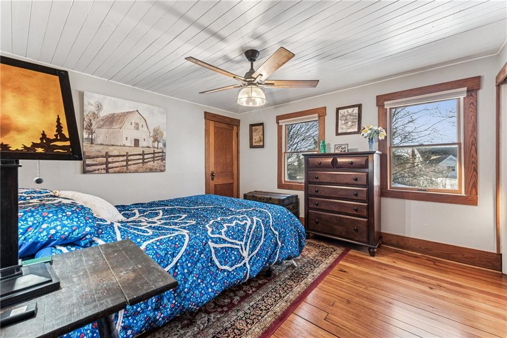 3150 Dutch Ridge Road Beaver, PA 15009 - Photo 25 of 41 a bedroom with a bed and a dresser with wooden floor