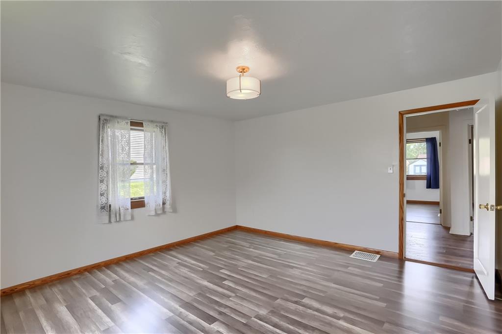 1081 Evans City Road Renfrew, PA 16053 - Photo 12 of 24 wooden floor in an empty room with a window