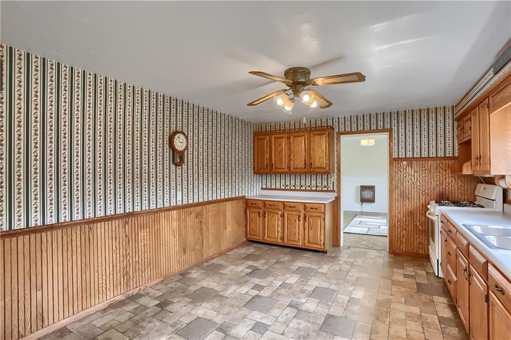 1081 Evans City Road Renfrew, PA 16053 - Photo 6 of 24 a view of a kitchen with a sink and a dishwasher