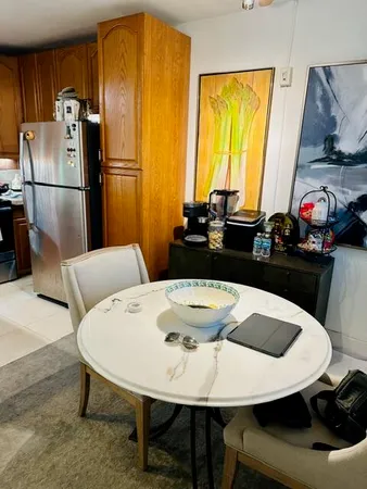 a kitchen with a table and chairs