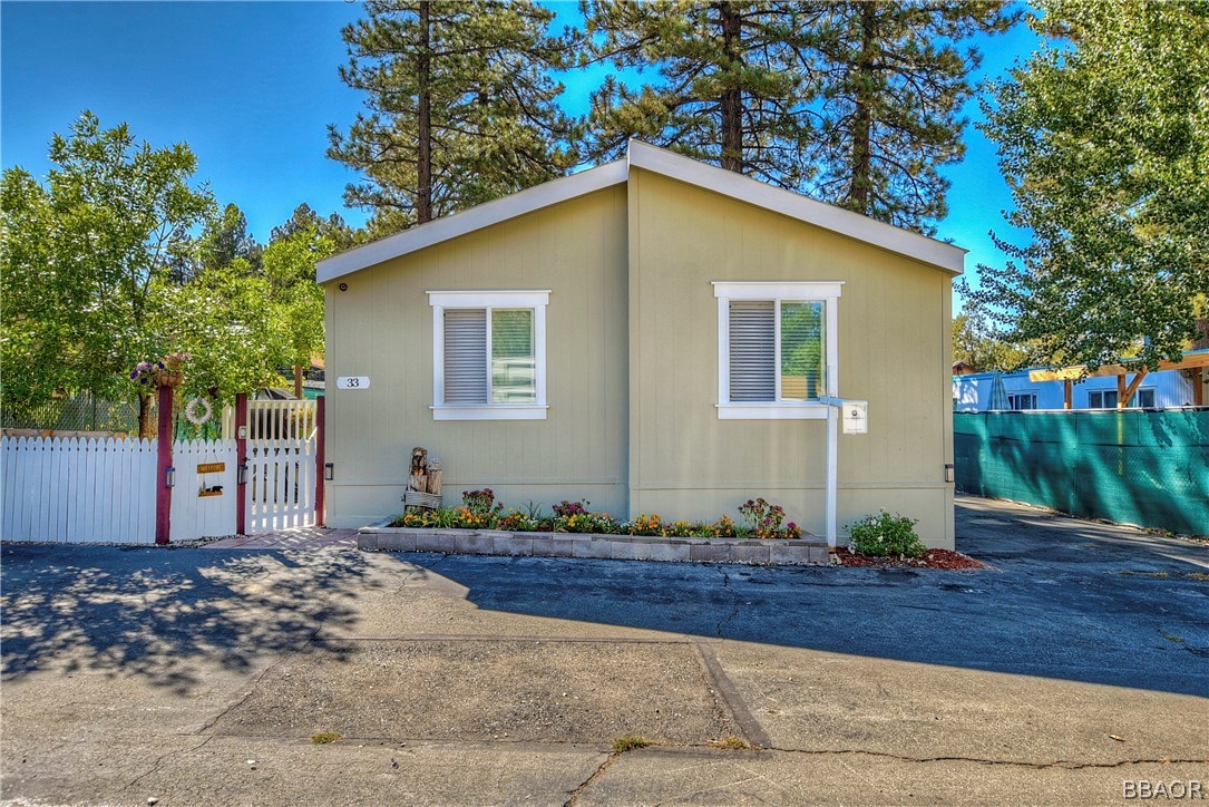 547 Alden Road, Unit 33 Big Bear Lake, CA 92315 - Photo 1 of 28 a view of a house with a yard