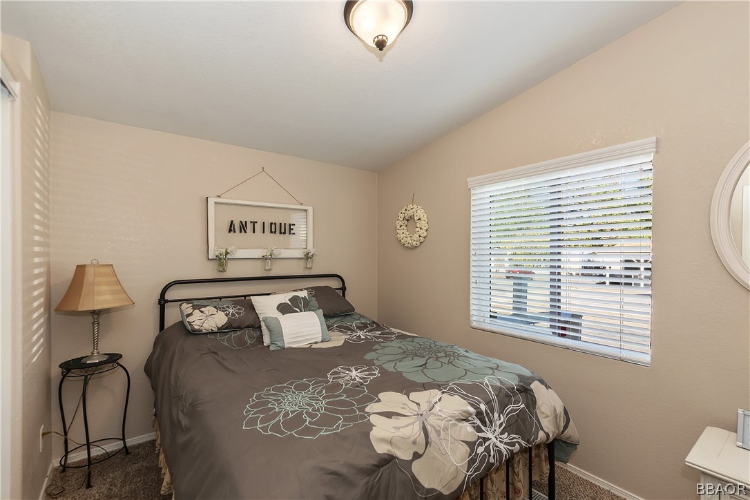 547 Alden Road, Unit 33 Big Bear Lake, CA 92315 - Photo 22 of 28 a bedroom with a bed and window