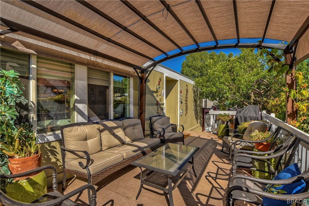 547 Alden Road, Unit 33 Big Bear Lake, CA 92315 - Photo 5 of 28 a view of a patio with table and chairs and potted plants