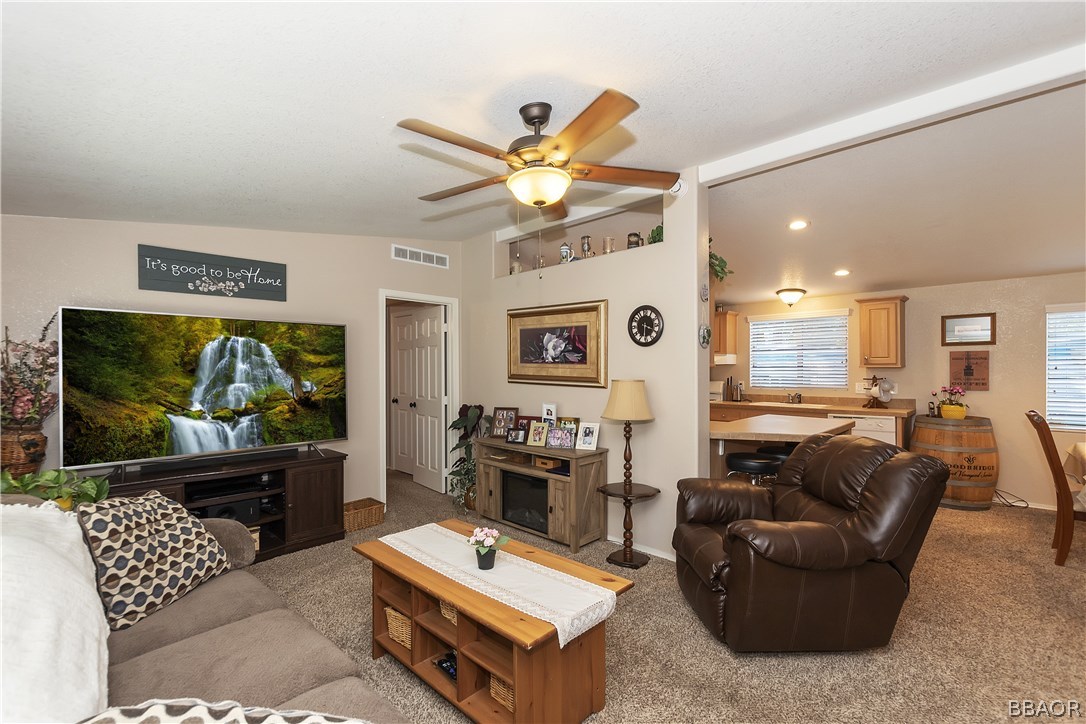 547 Alden Road, Unit 33 Big Bear Lake, CA 92315 - Photo 7 of 28 a living room with furniture and a flat screen tv