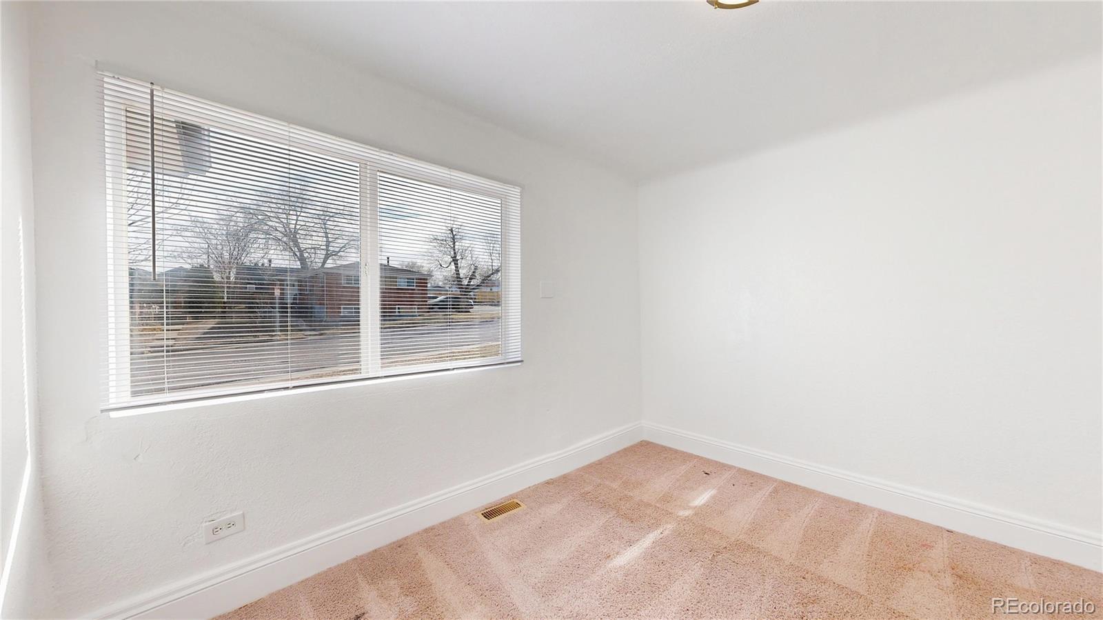 345 South Utica Street Denver, CO 80219 - Photo 13 of 19 a view of empty room with windows
