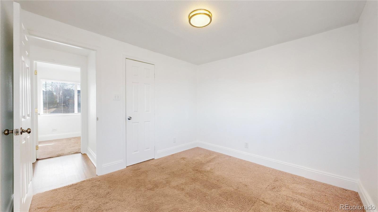 345 South Utica Street Denver, CO 80219 - Photo 16 of 19 a view of a livingroom and a bathroom