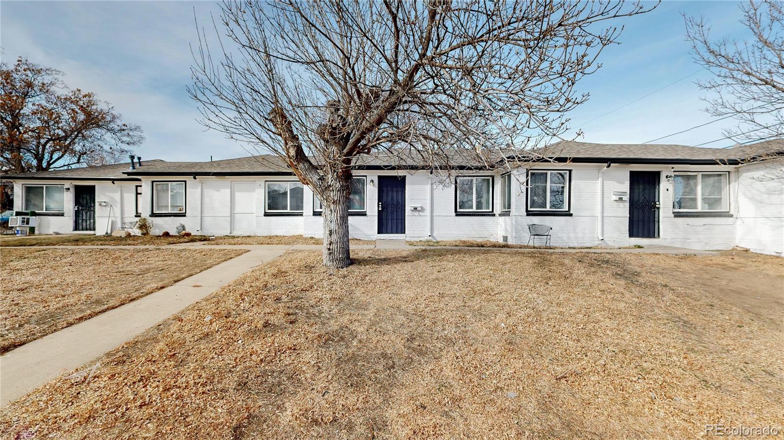 345 South Utica Street Denver, CO 80219 - Photo 17 of 19 front view of a house with a yard