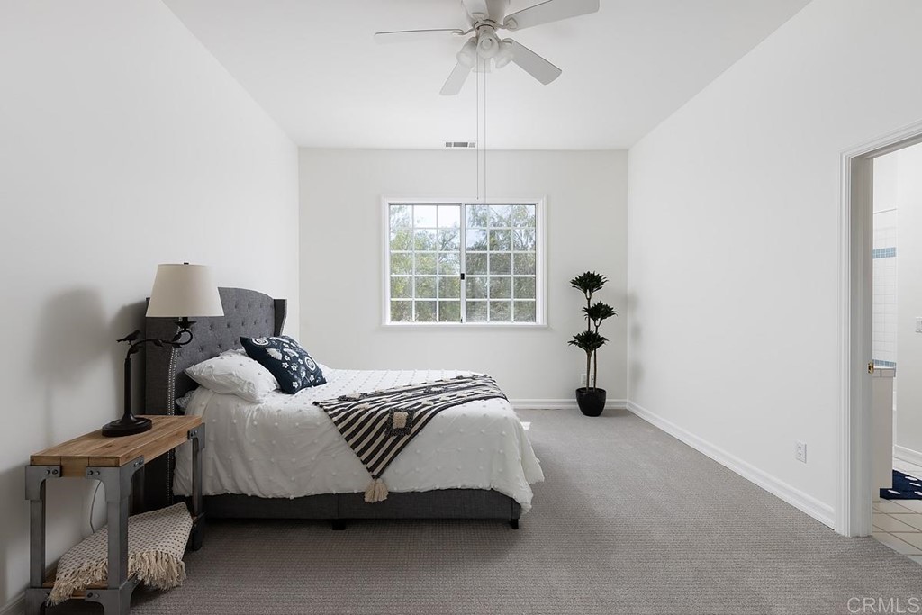 6949 Elfin Oaks Road Escondido, CA 92029 - Photo 11 of 24 a bedroom with bed and window