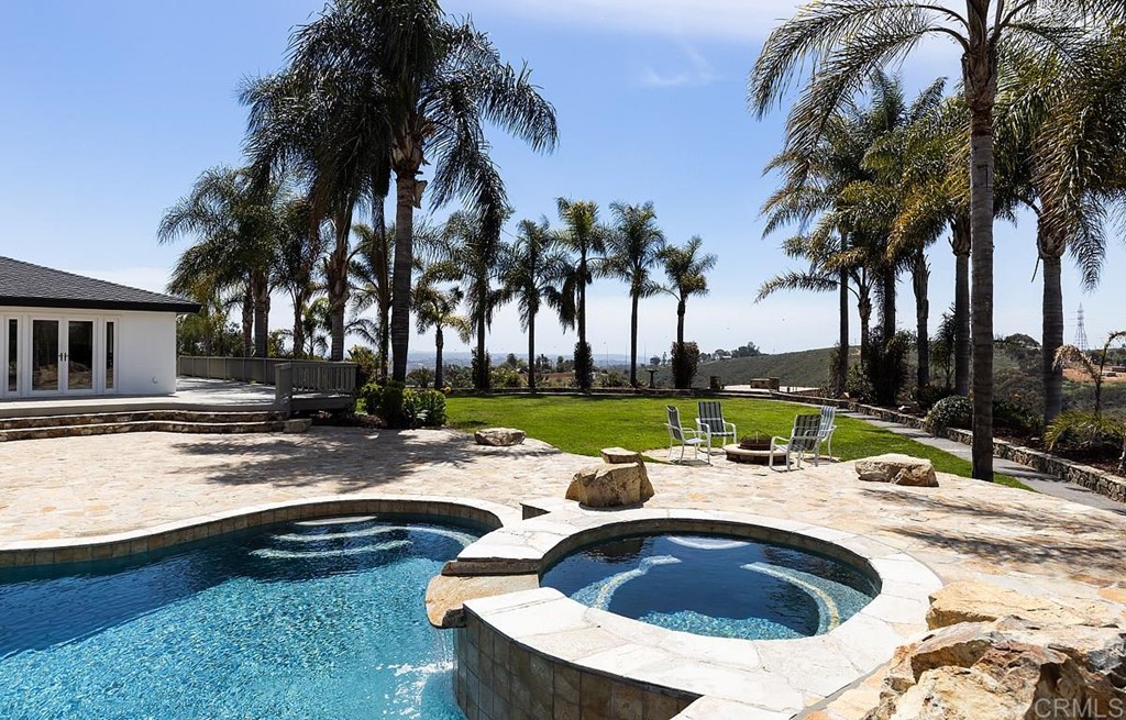 6949 Elfin Oaks Road Escondido, CA 92029 - Photo 21 of 24 a view of swimming pool with a patio and a swimming pool