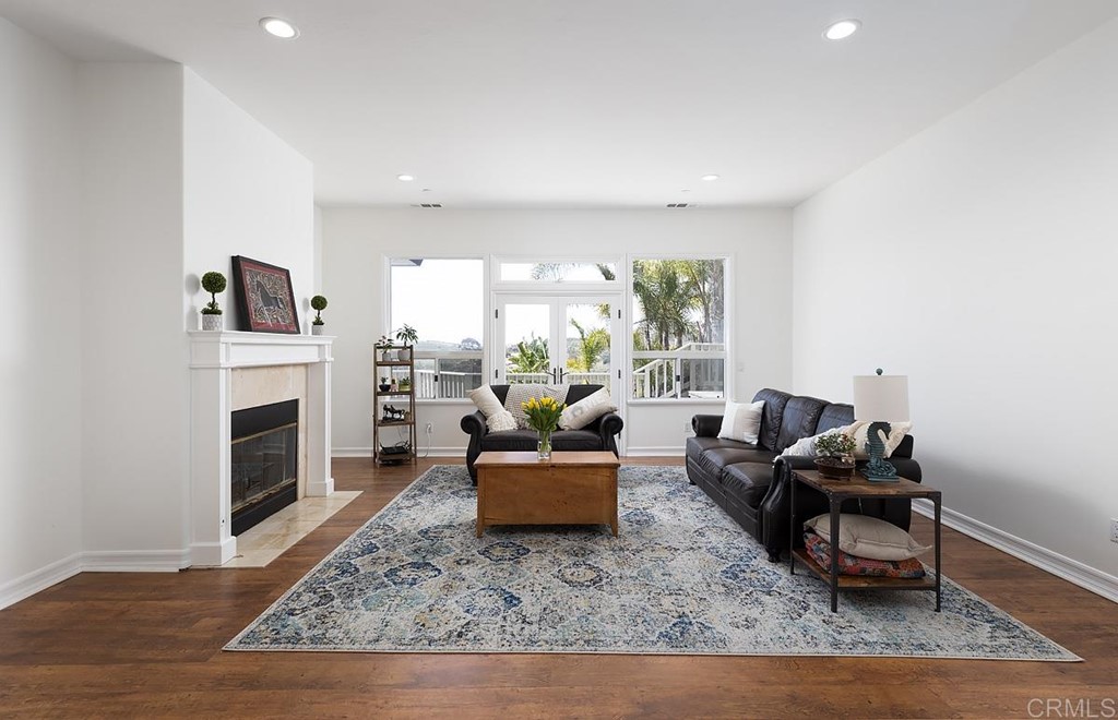 6949 Elfin Oaks Road Escondido, CA 92029 - Photo 3 of 24 a living room with furniture and a fireplace