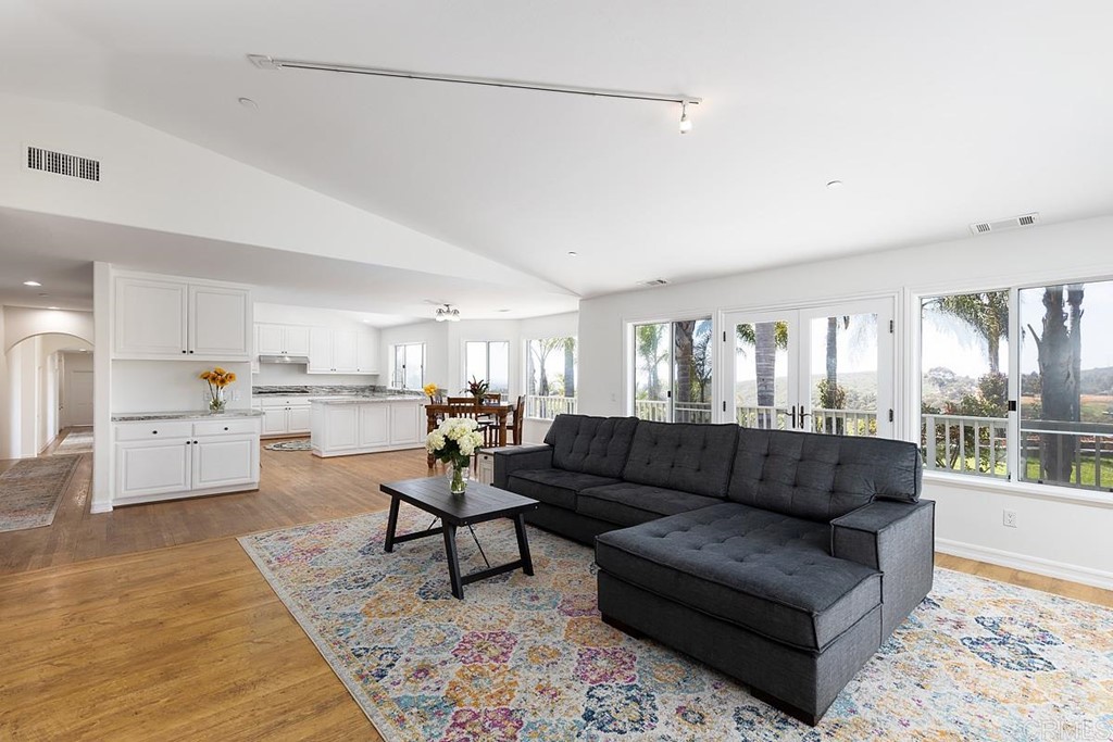 6949 Elfin Oaks Road Escondido, CA 92029 - Photo 4 of 24 a living room with furniture and view of kitchen
