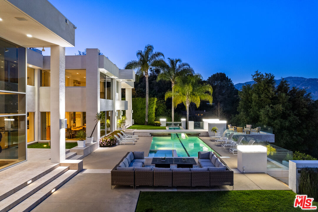 300 North San Rafael Avenue Pasadena, CA 91105 - Photo 6 of 12 a view of pool with lawn chairs and a yard