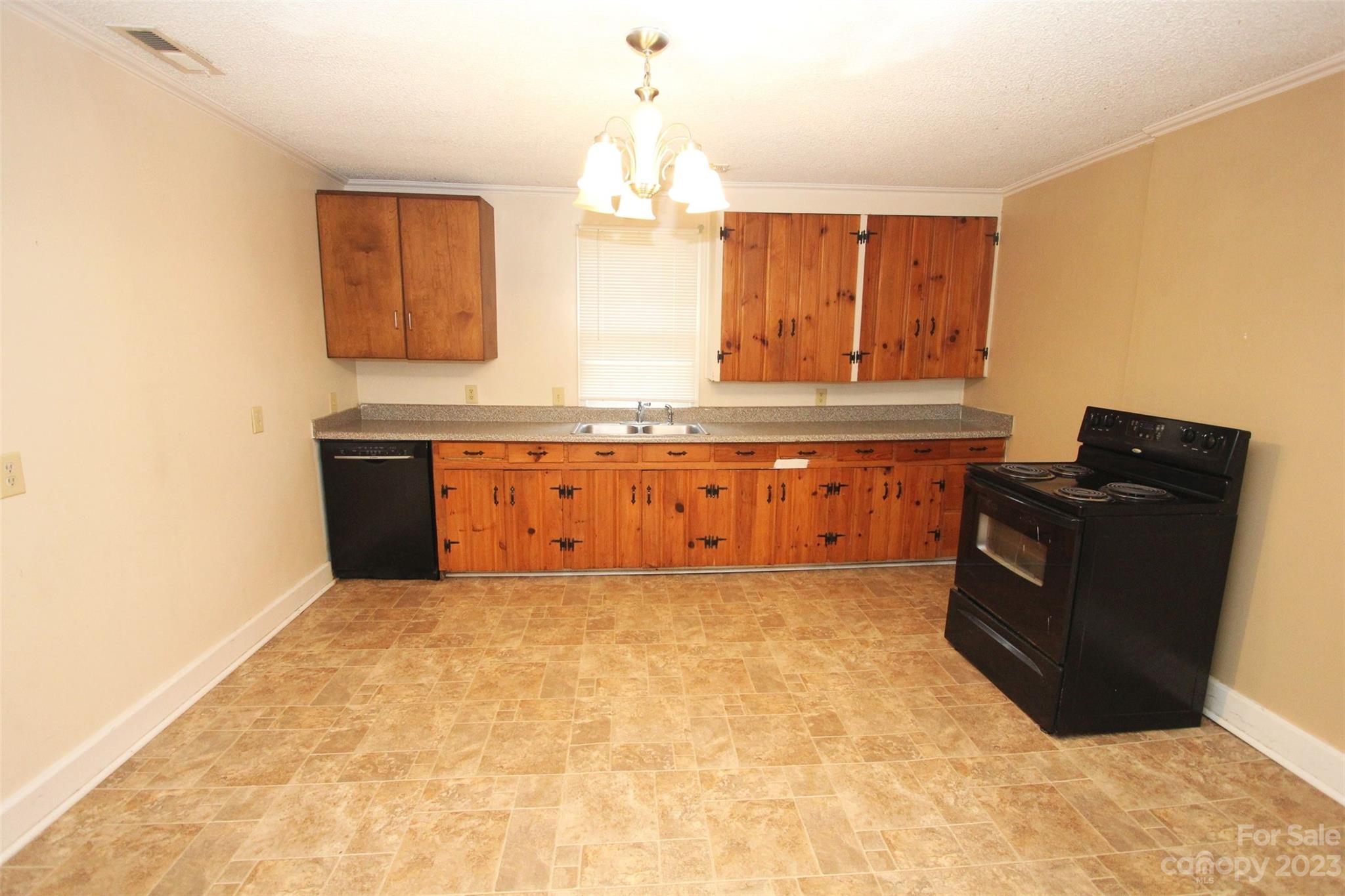 488 Savannah Road Peachland, NC 28133 - Photo 11 of 35 a view of kitchen with granite countertop cabinets and a sink