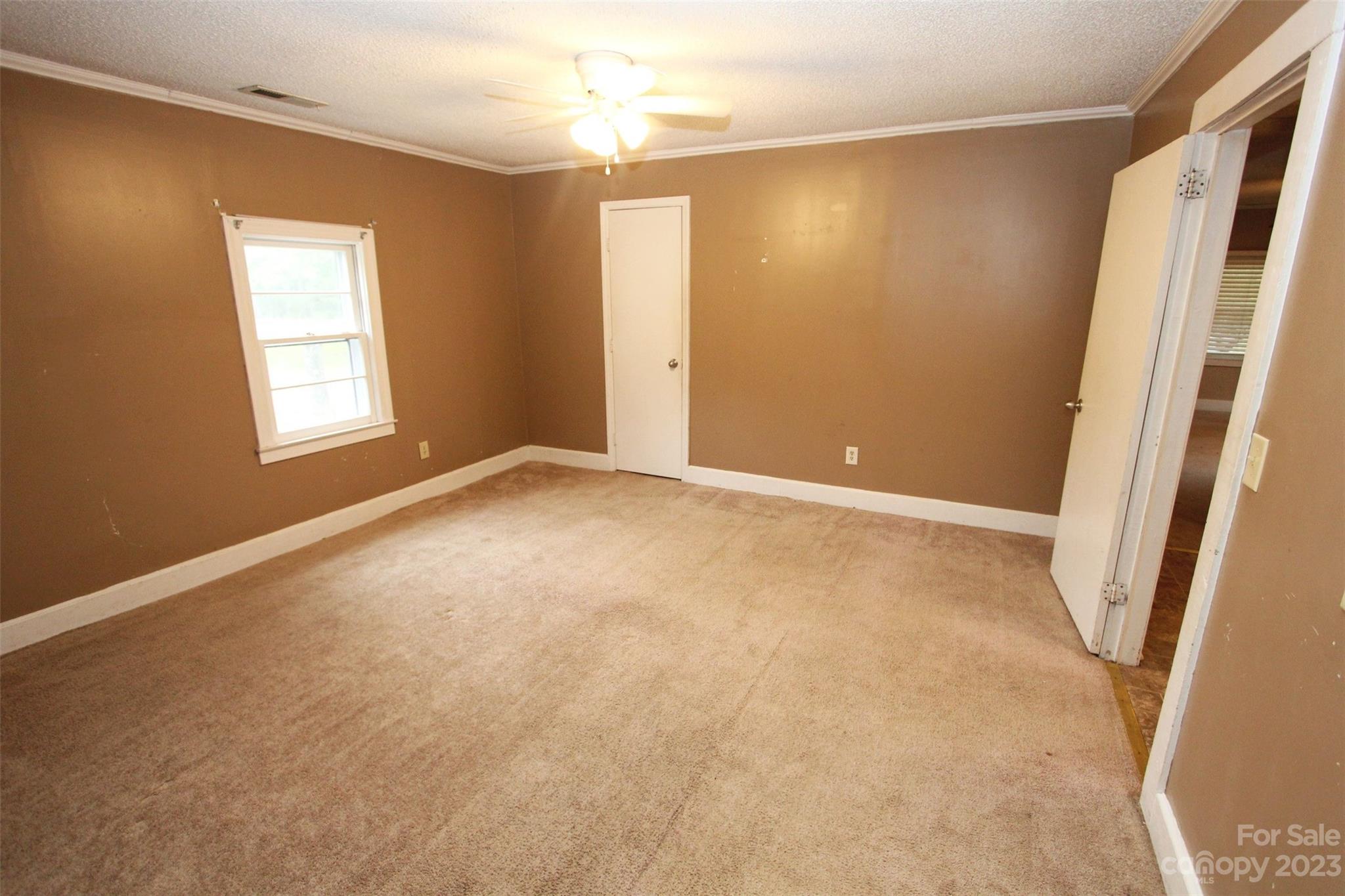 488 Savannah Road Peachland, NC 28133 - Photo 21 of 35 an empty room with windows and closet