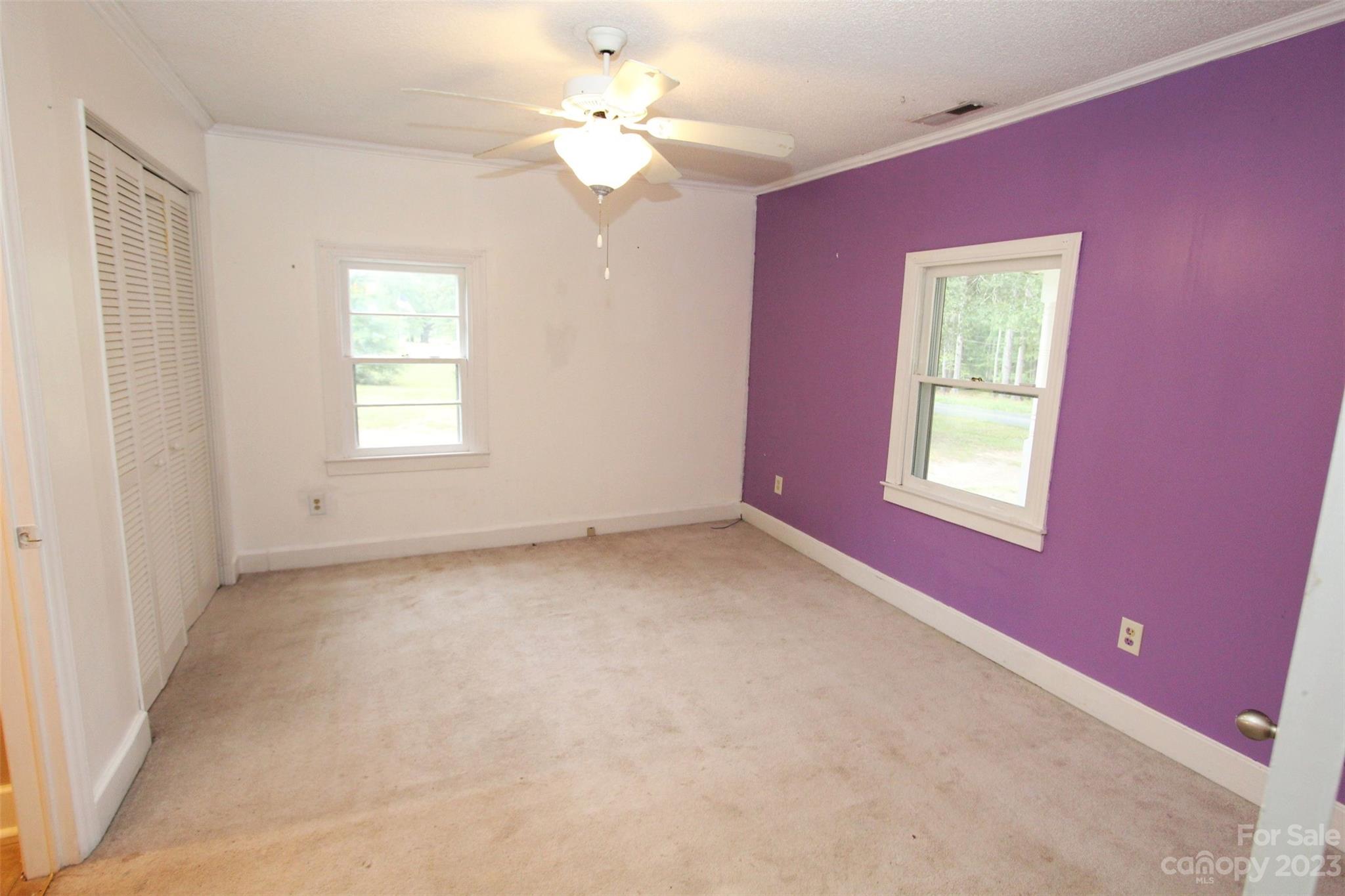 488 Savannah Road Peachland, NC 28133 - Photo 23 of 35 an empty room with windows and fan