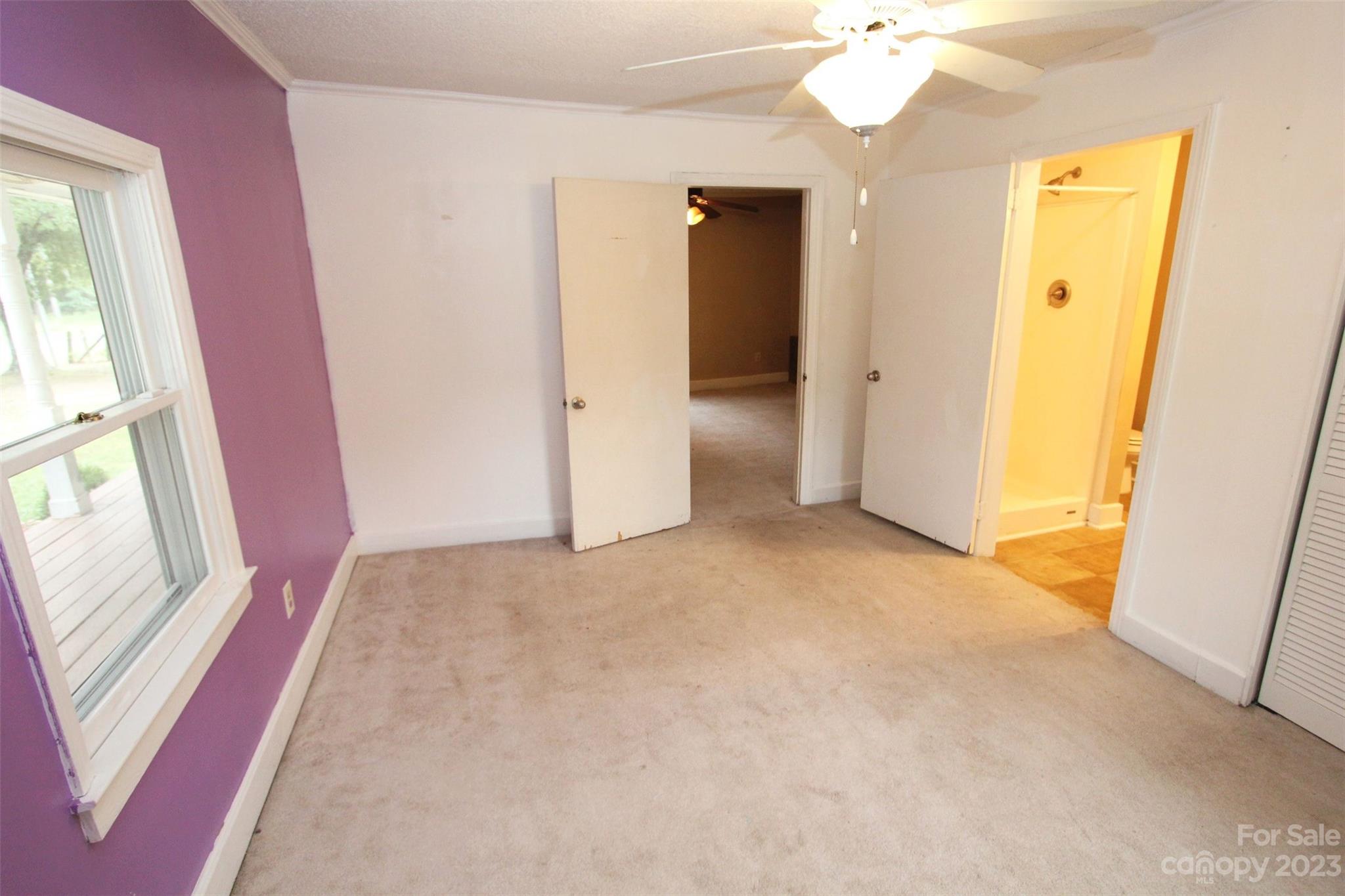 488 Savannah Road Peachland, NC 28133 - Photo 24 of 35 an empty room with windows and entrance