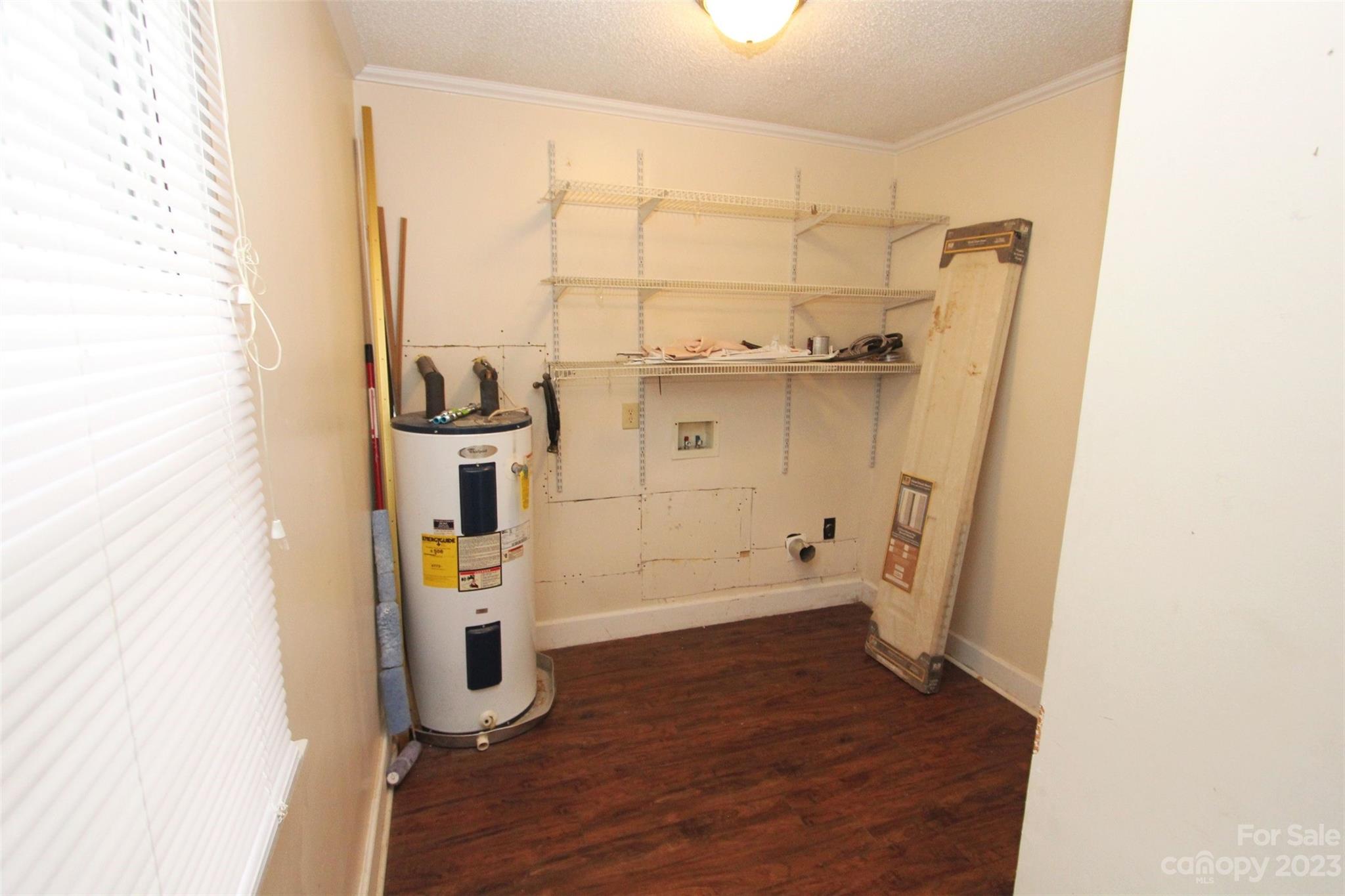 488 Savannah Road Peachland, NC 28133 - Photo 26 of 35 an empty room with wooden floor and a window