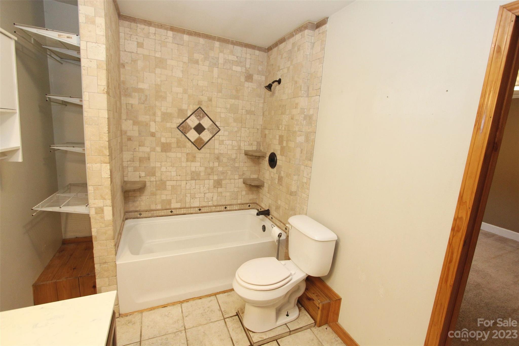 488 Savannah Road Peachland, NC 28133 - Photo 27 of 35 a bathroom with a toilet and a shower